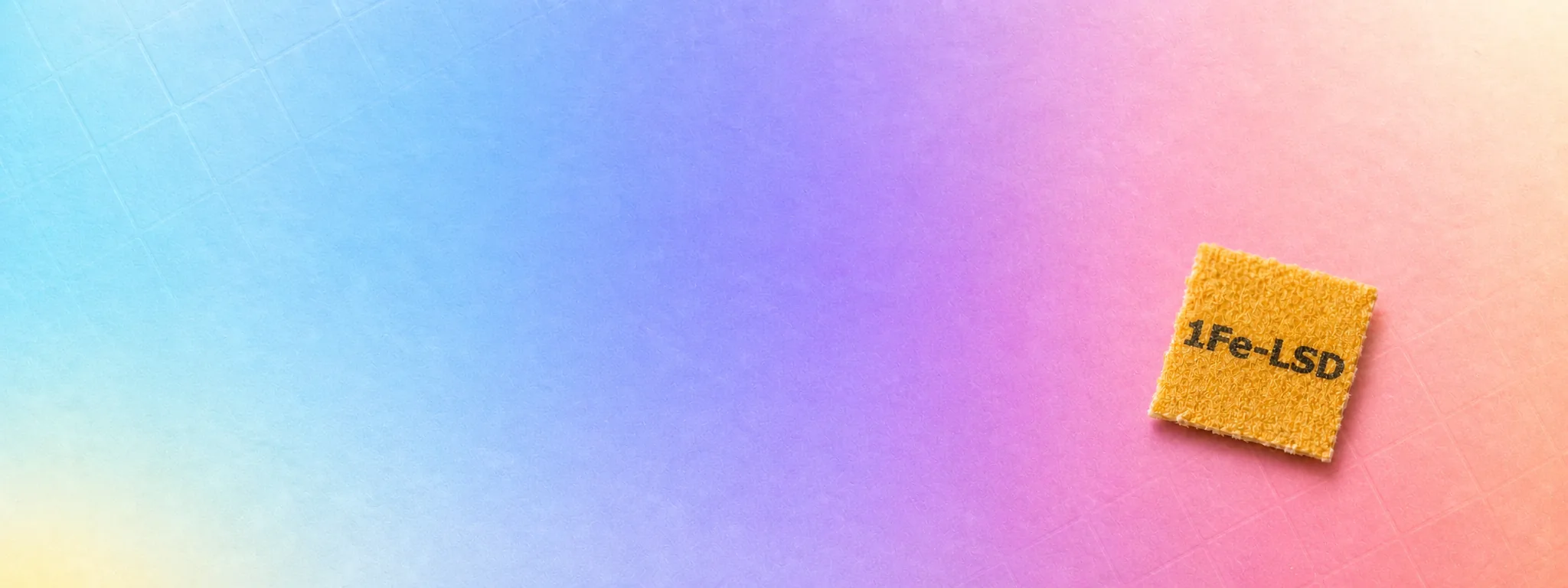 Symbolisches 1Fe-LSD-Blotter auf farbigem Hintergrund